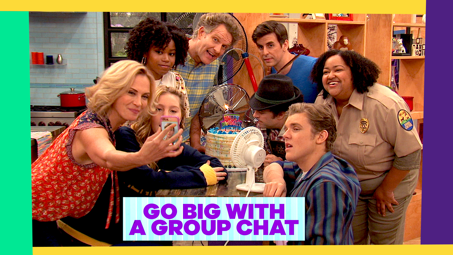 Title: Go Big With A Group Chat. The cast of Henry Danger gathers around a birthday cake to send a group selfie